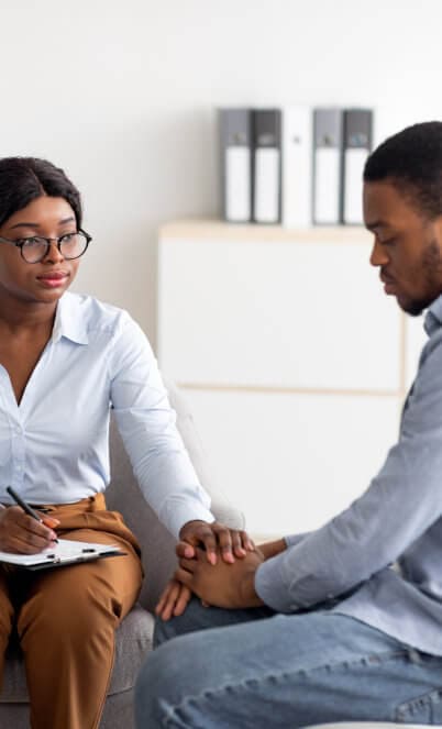 caregiver visits senior man suffering with depression