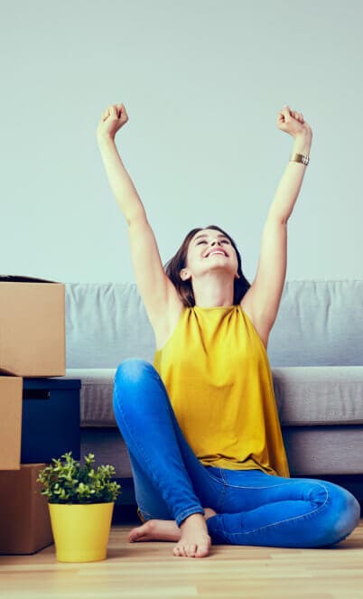 happy young woman moving to new home - having fun