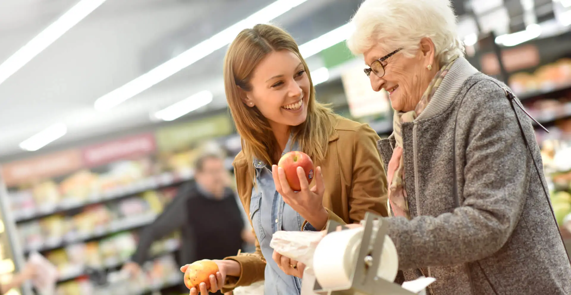 elderly woman with young woman at the grocery store
